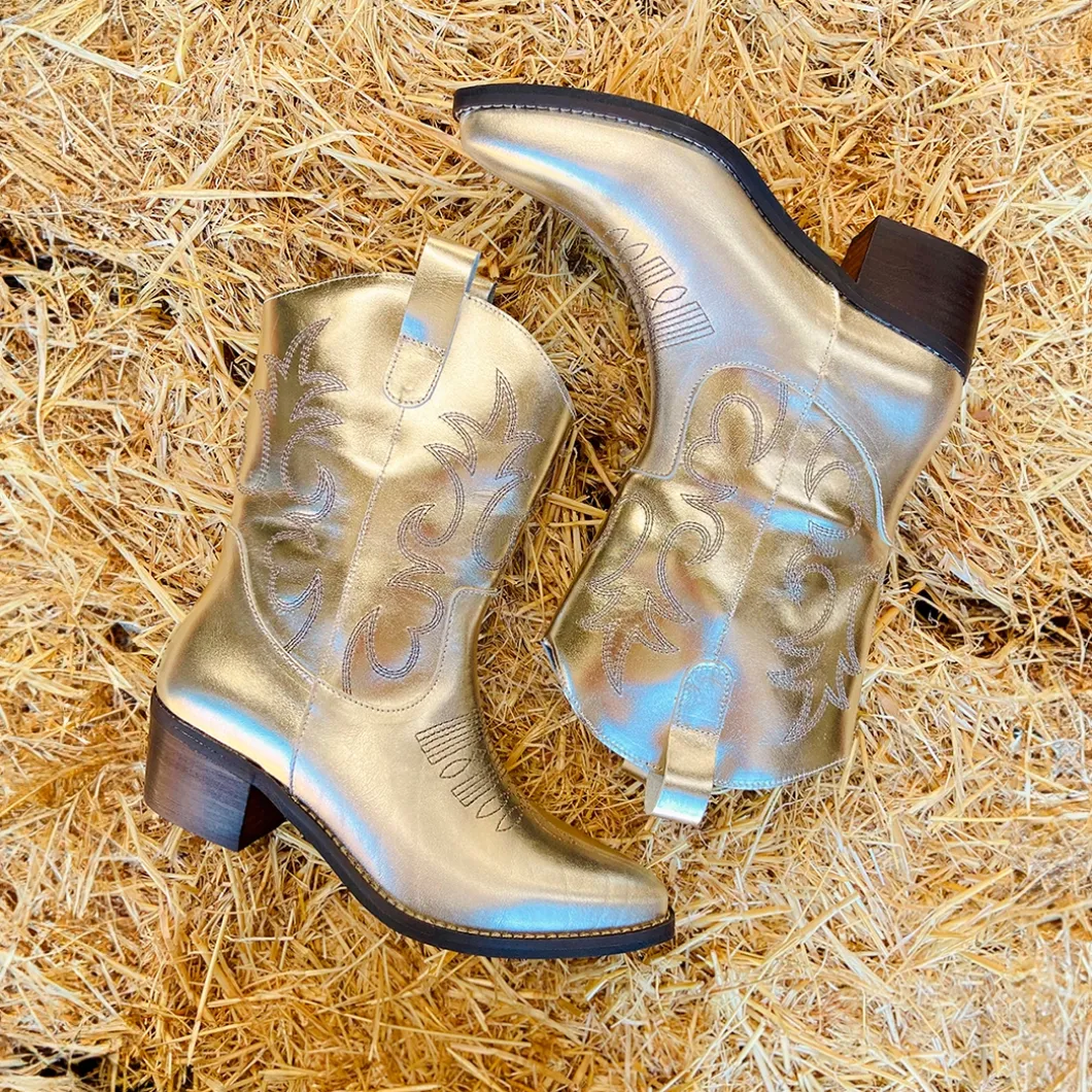 Botín campera dorada de piel