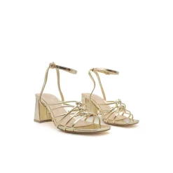 Sandalias doradas nudo tacón ancho​