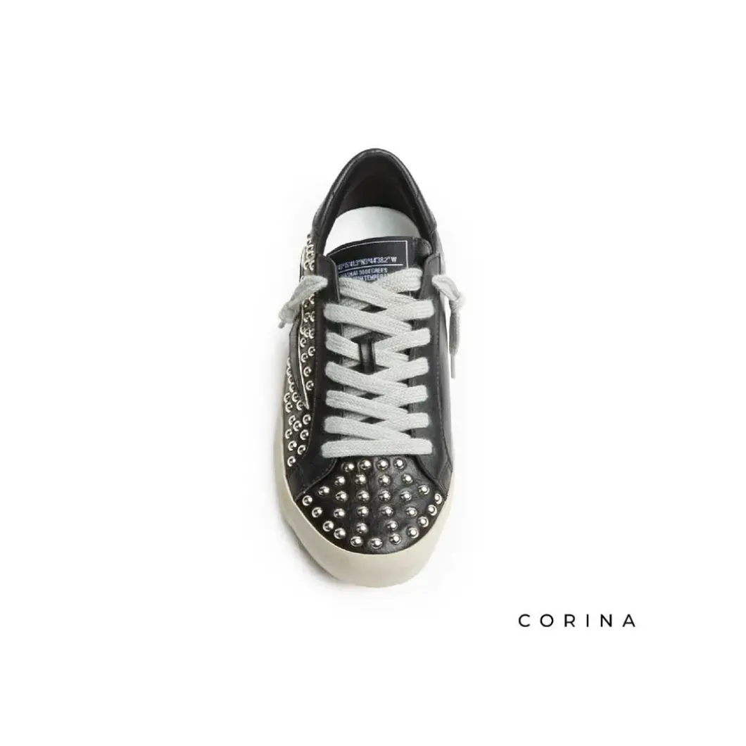 Zapatillas tachuelas efecto cuero negro